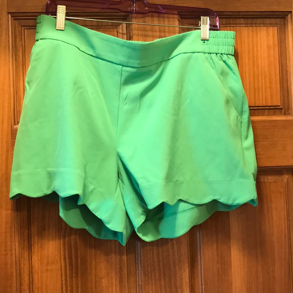 Green scalloped shorts